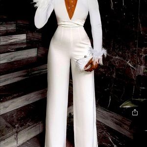 Fitted white jumpsuits with nude mesh cleavage area